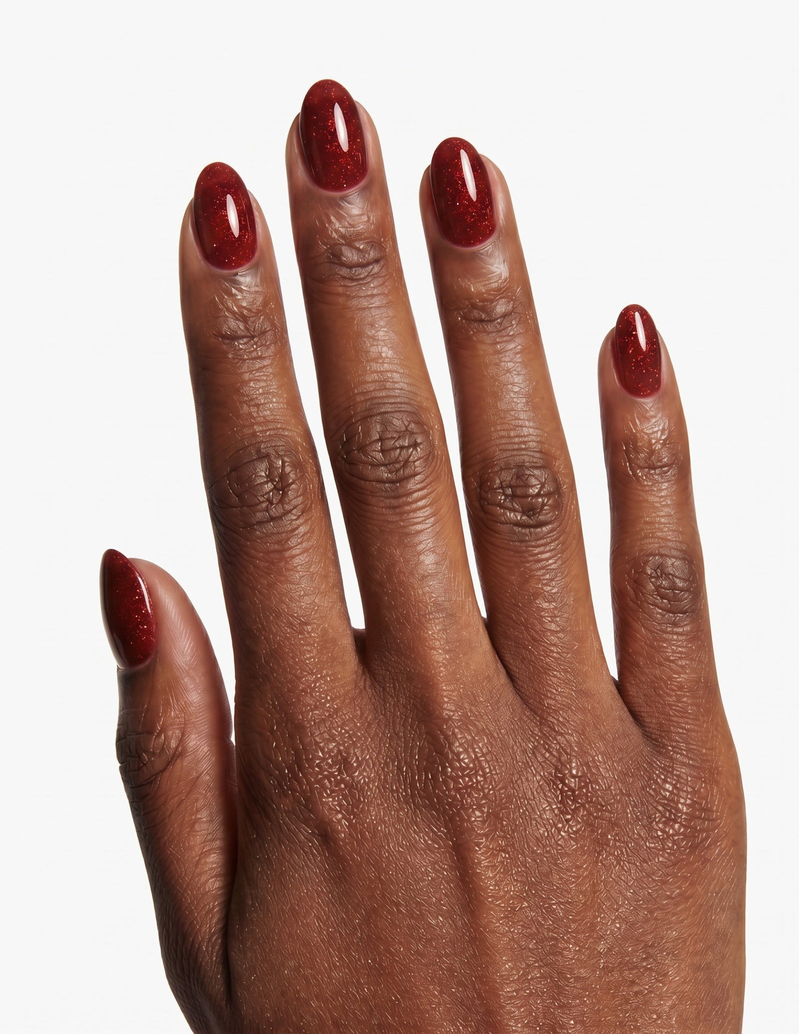 Garnet press-on nails — Almond (extra-short), deep-skin hand, back of hand
