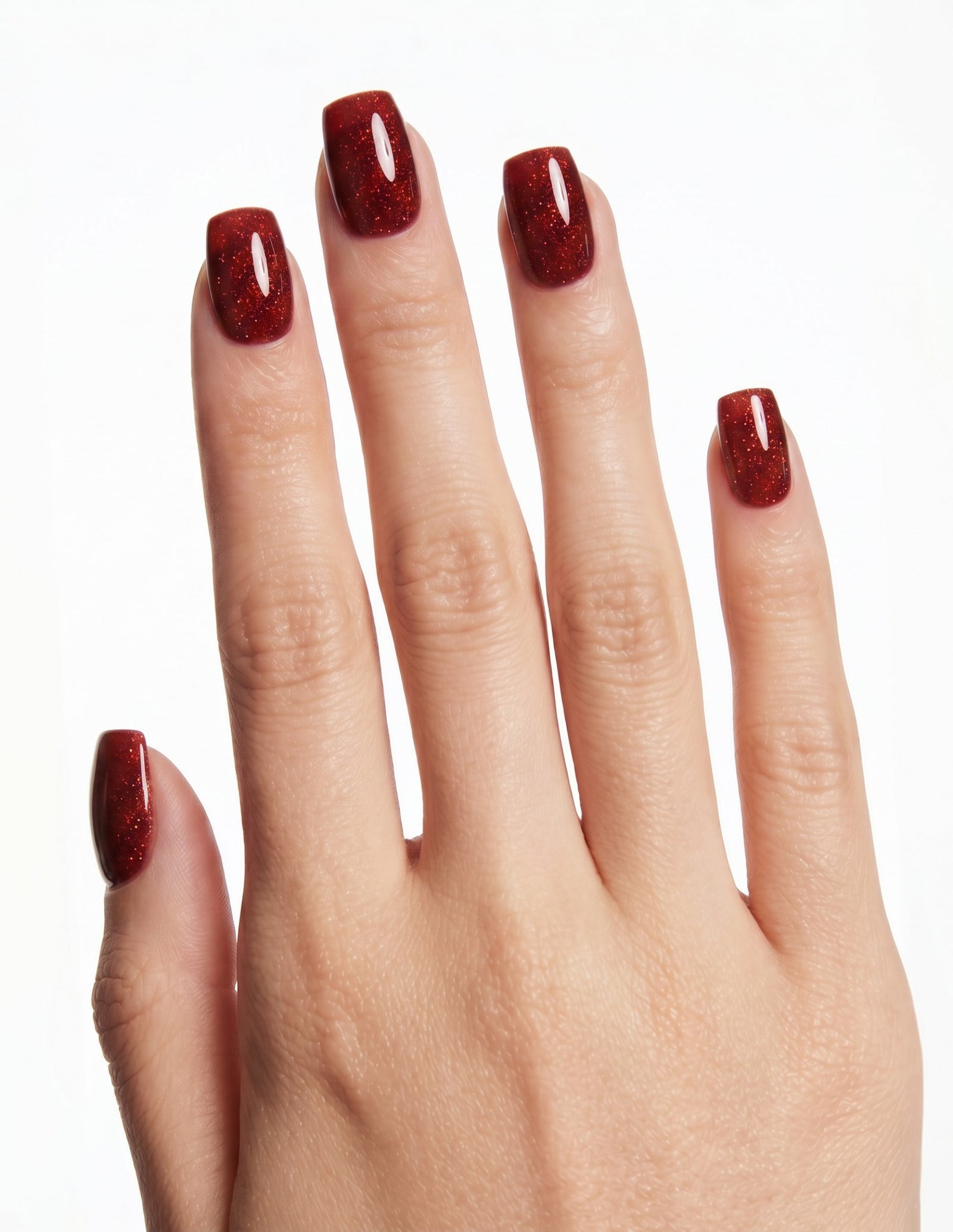 Garnet press-on nails — Coffin (short), light-skin hand, back of hand