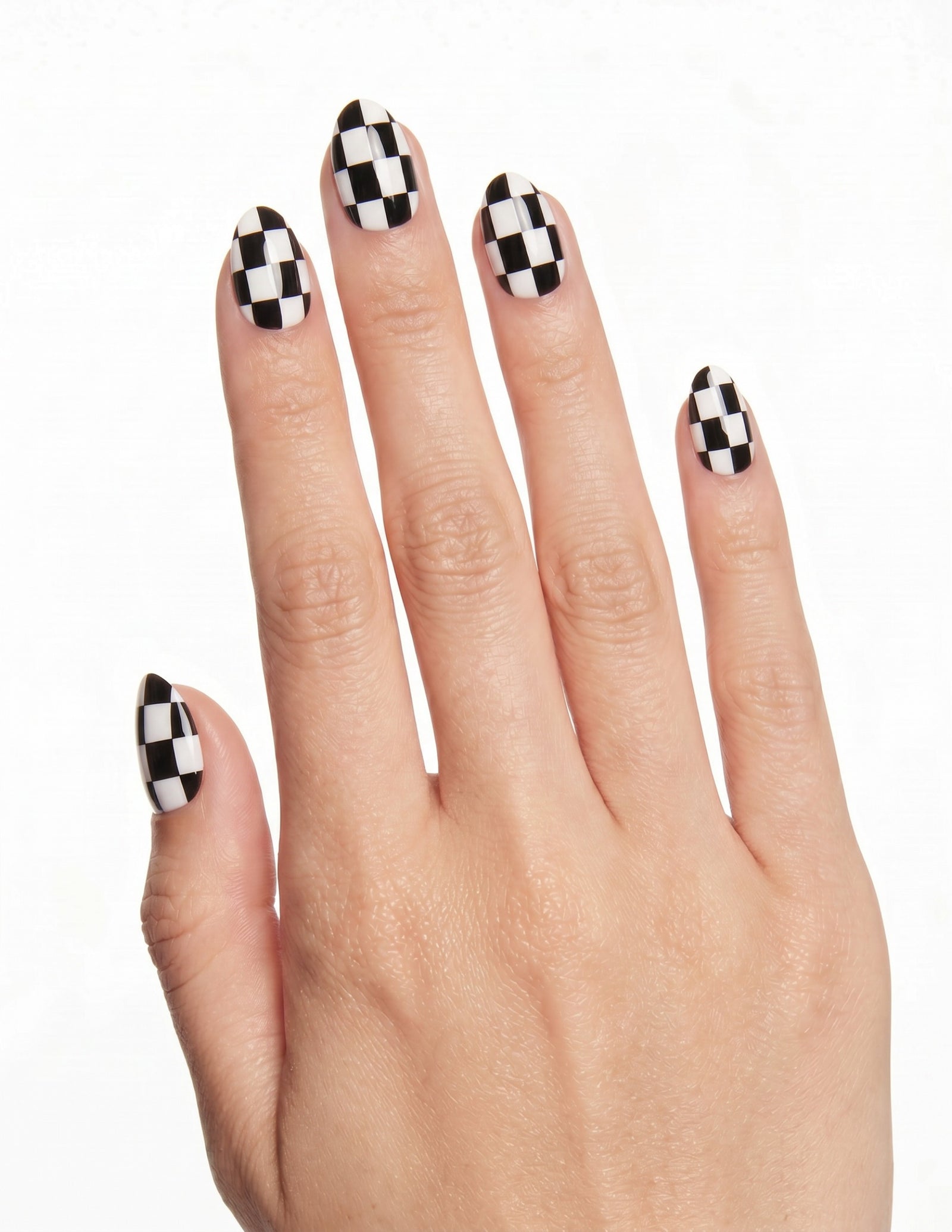 Checkmate press-on nails — Almond (extra-short), light-skin hand, back of hand
