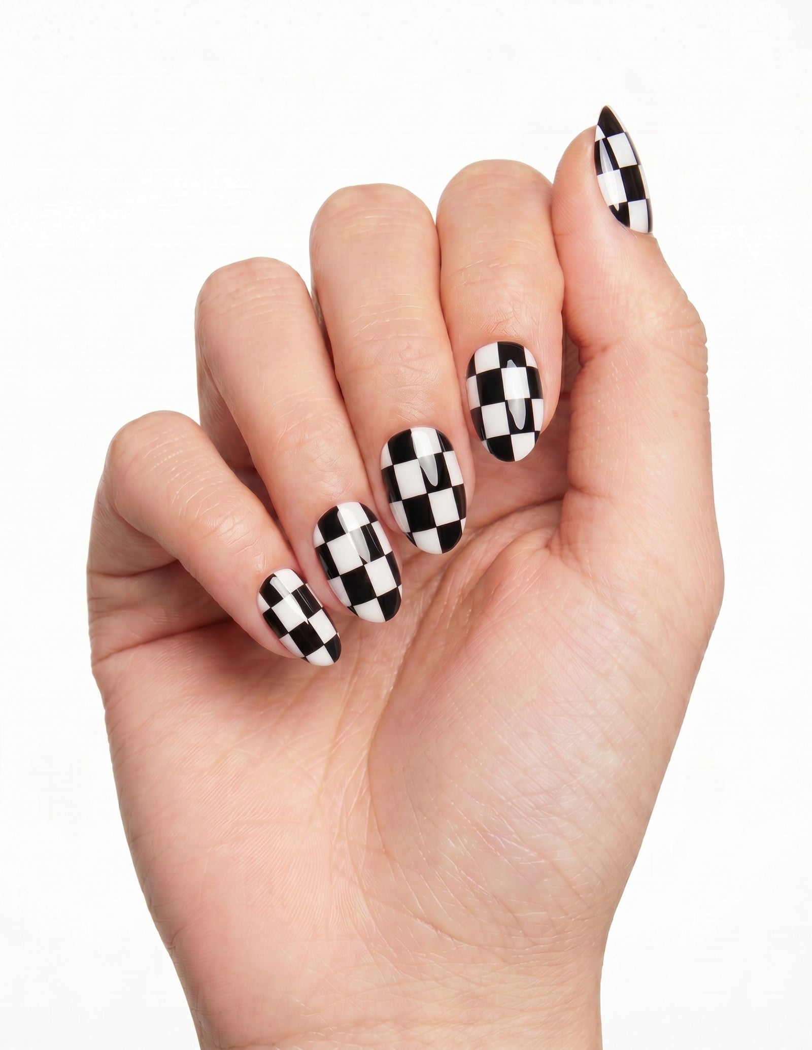 Checkmate press-on nails — Almond (extra-short), deep-skin hand, fingers curled