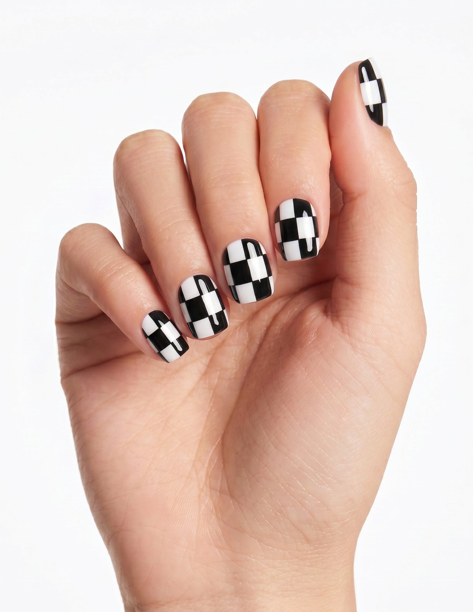 Checkmate press-on nails — Coffin (short), light-skin hand, fingers curled