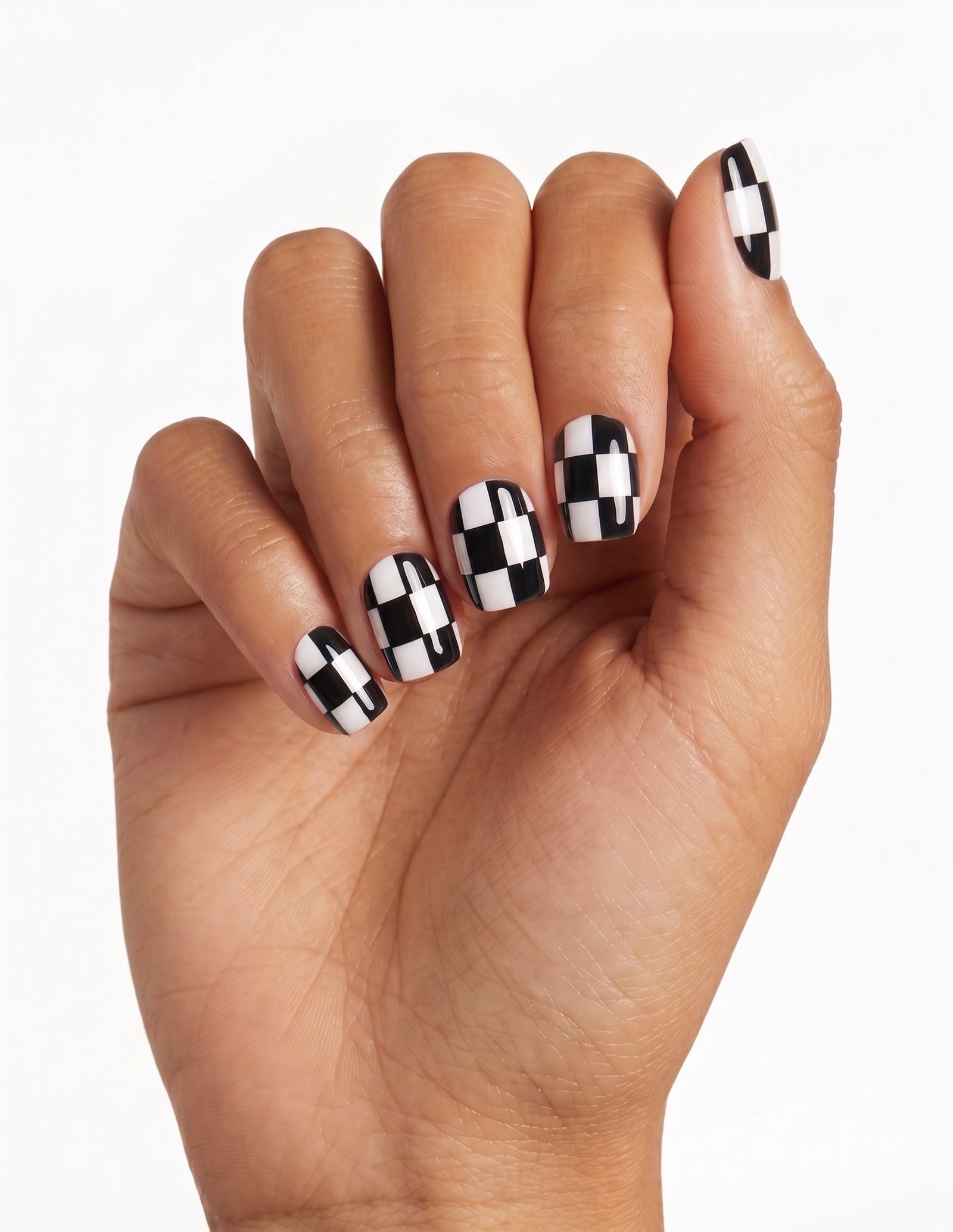 Checkmate press-on nails — Coffin (short), tan hand, fingers curled