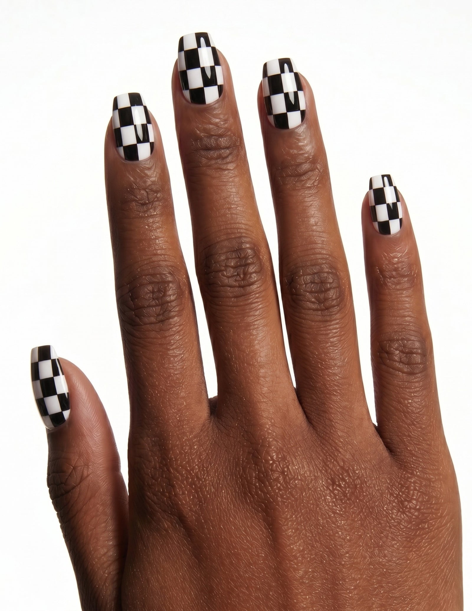 Checkmate press-on nails — Coffin (short), deep-skin hand, back of hand