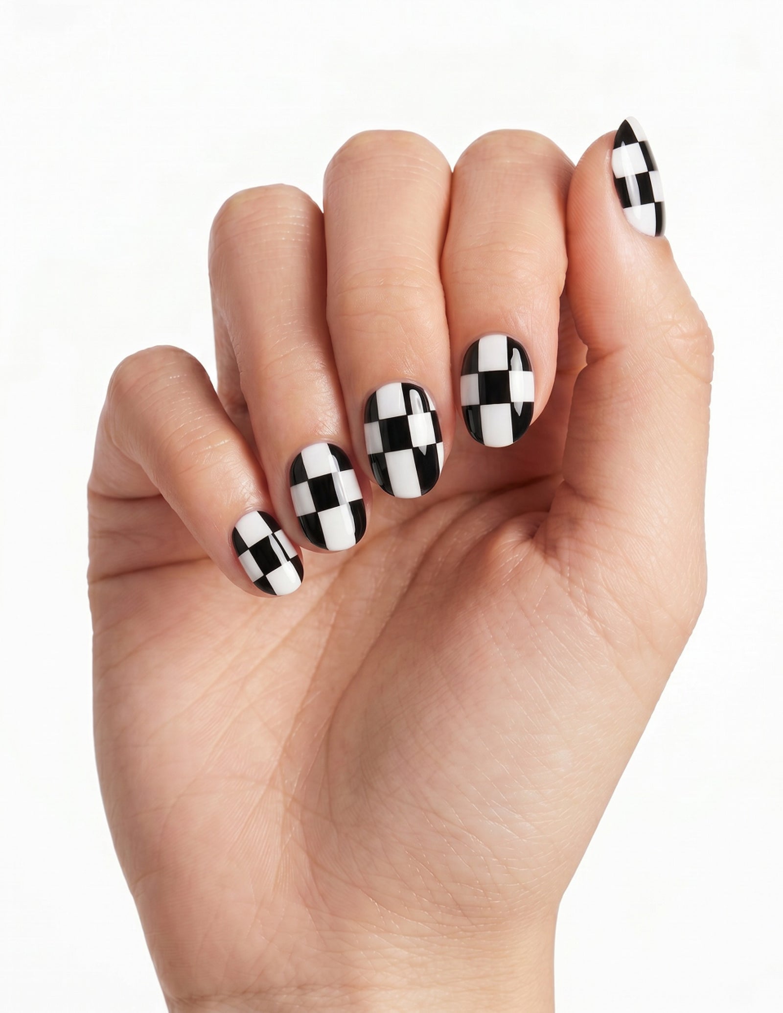 Checkmate press-on nails — Oval (extra-short), light-skin hand, fingers curled