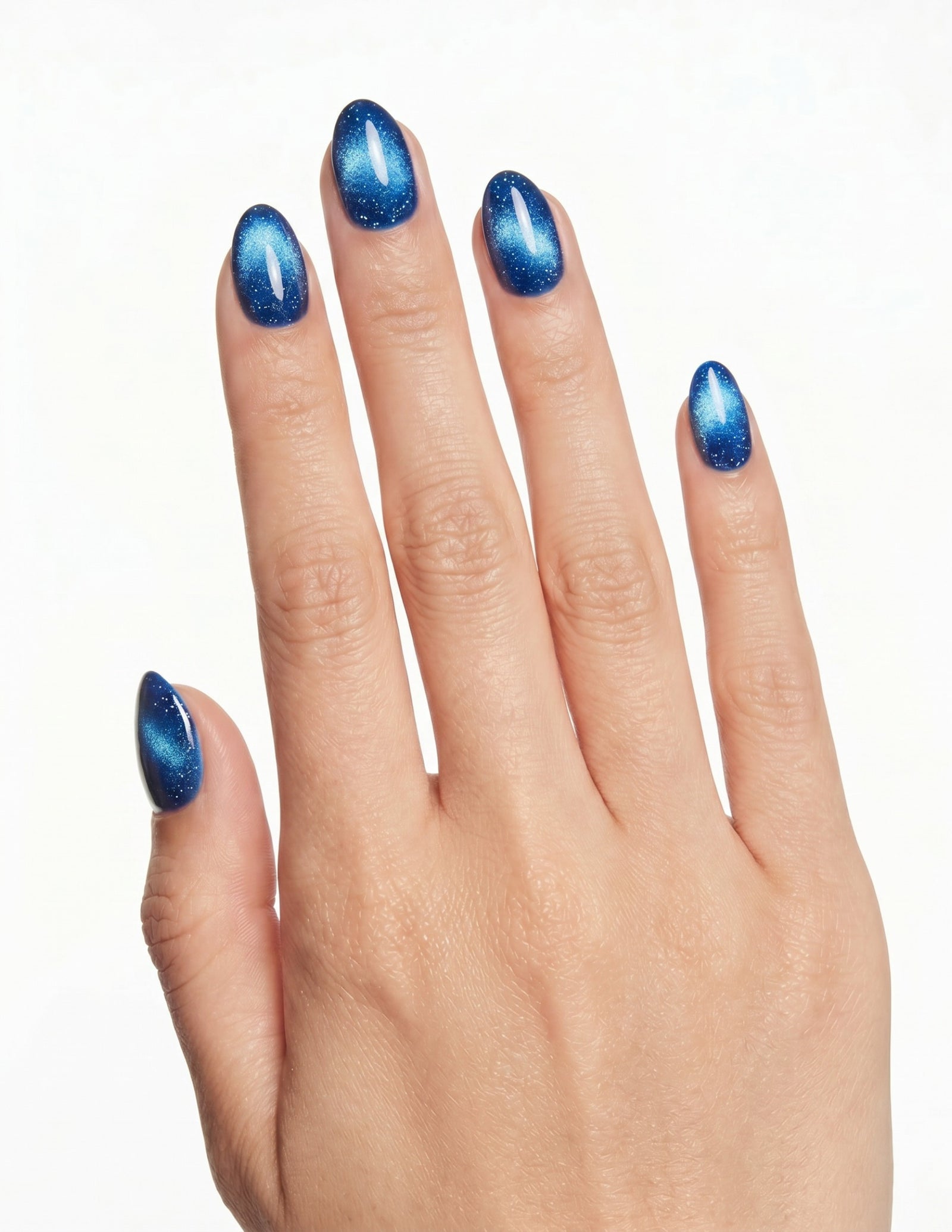 Cobalt press-on nails — Almond (extra-short), light-skin hand, back of hand