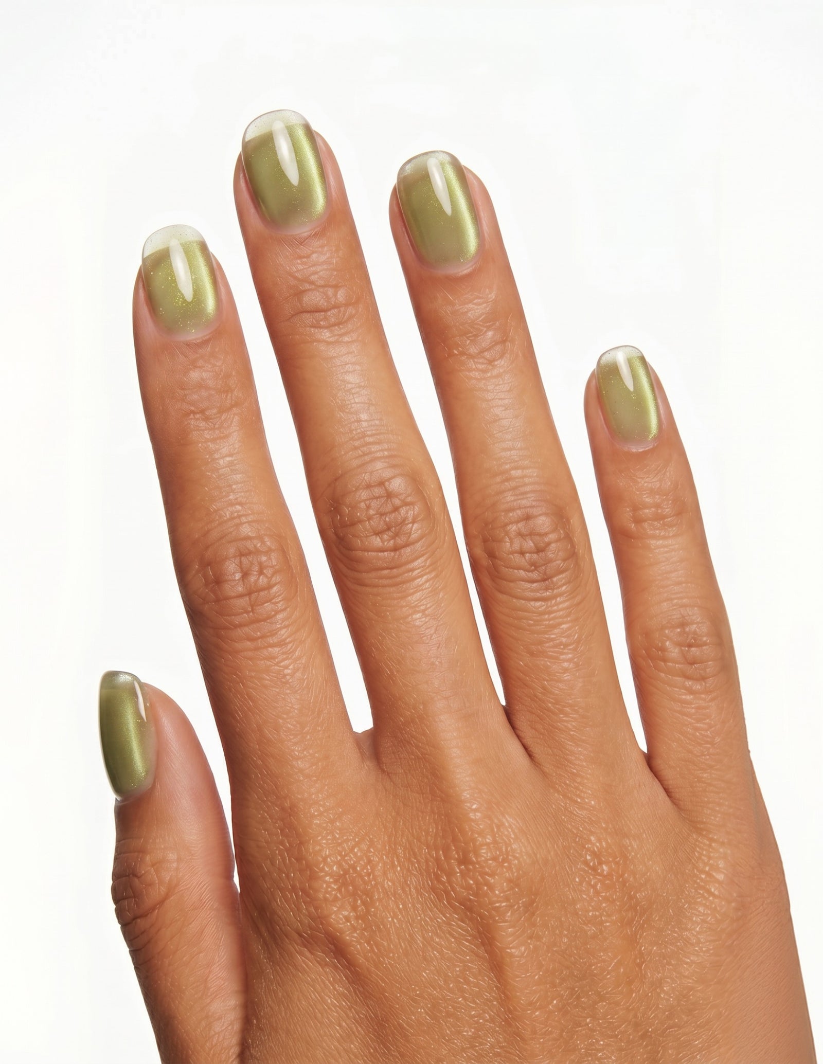 Olive Velvet press-on nails — Oval (extra-short), tan hand, back of hand