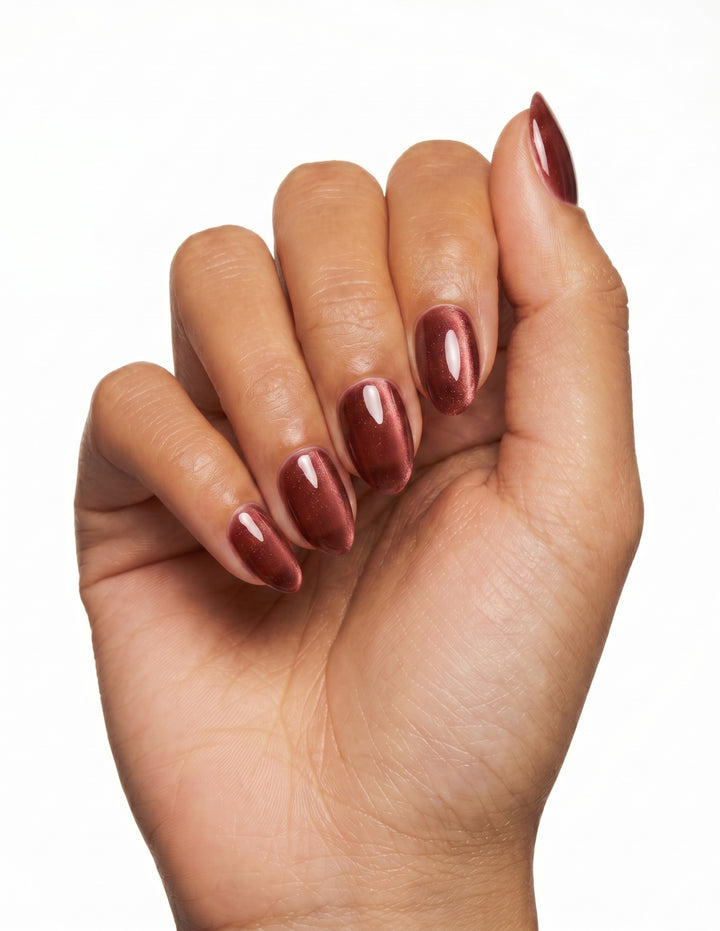 Espresso Velvet press-on nails — Almond (extra-short), tan hand, fingers curled