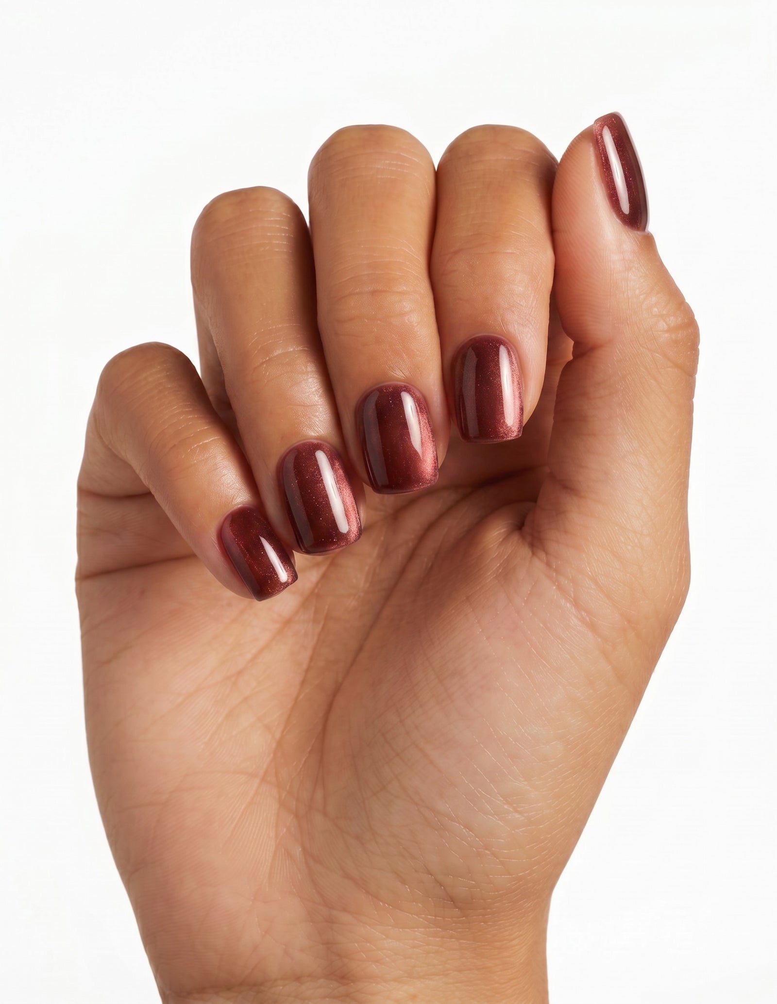 Espresso Velvet press-on nails — Coffin (short), tan hand, fingers curled