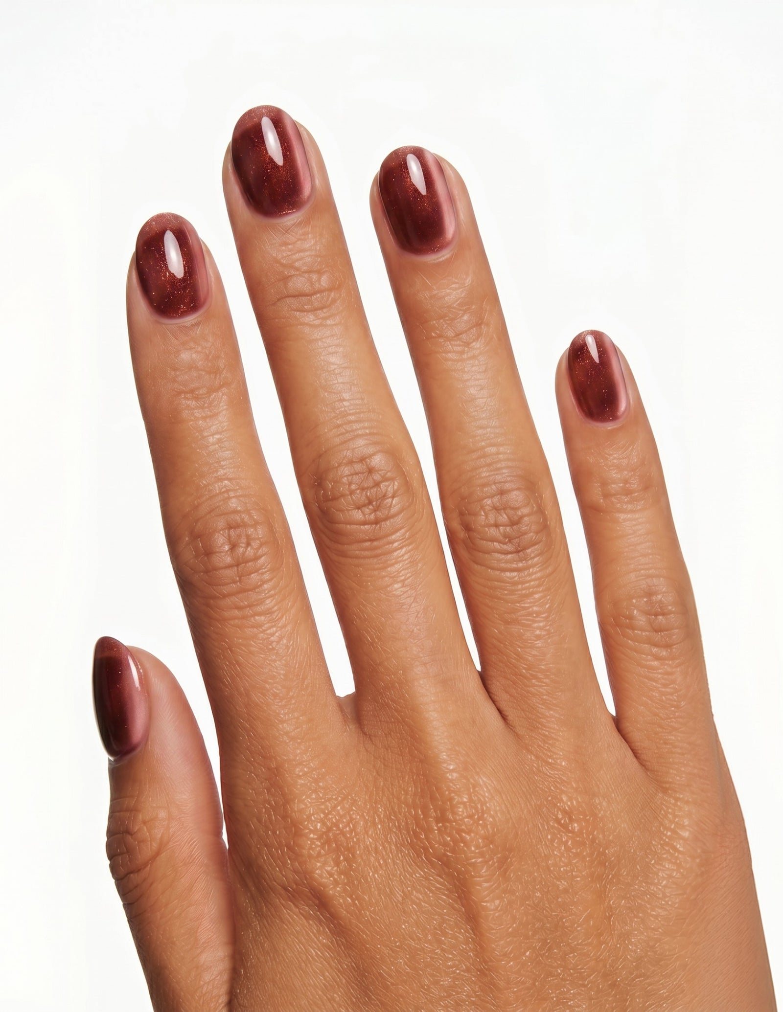Espresso Velvet press-on nails — Oval (extra-short), tan hand, back of hand