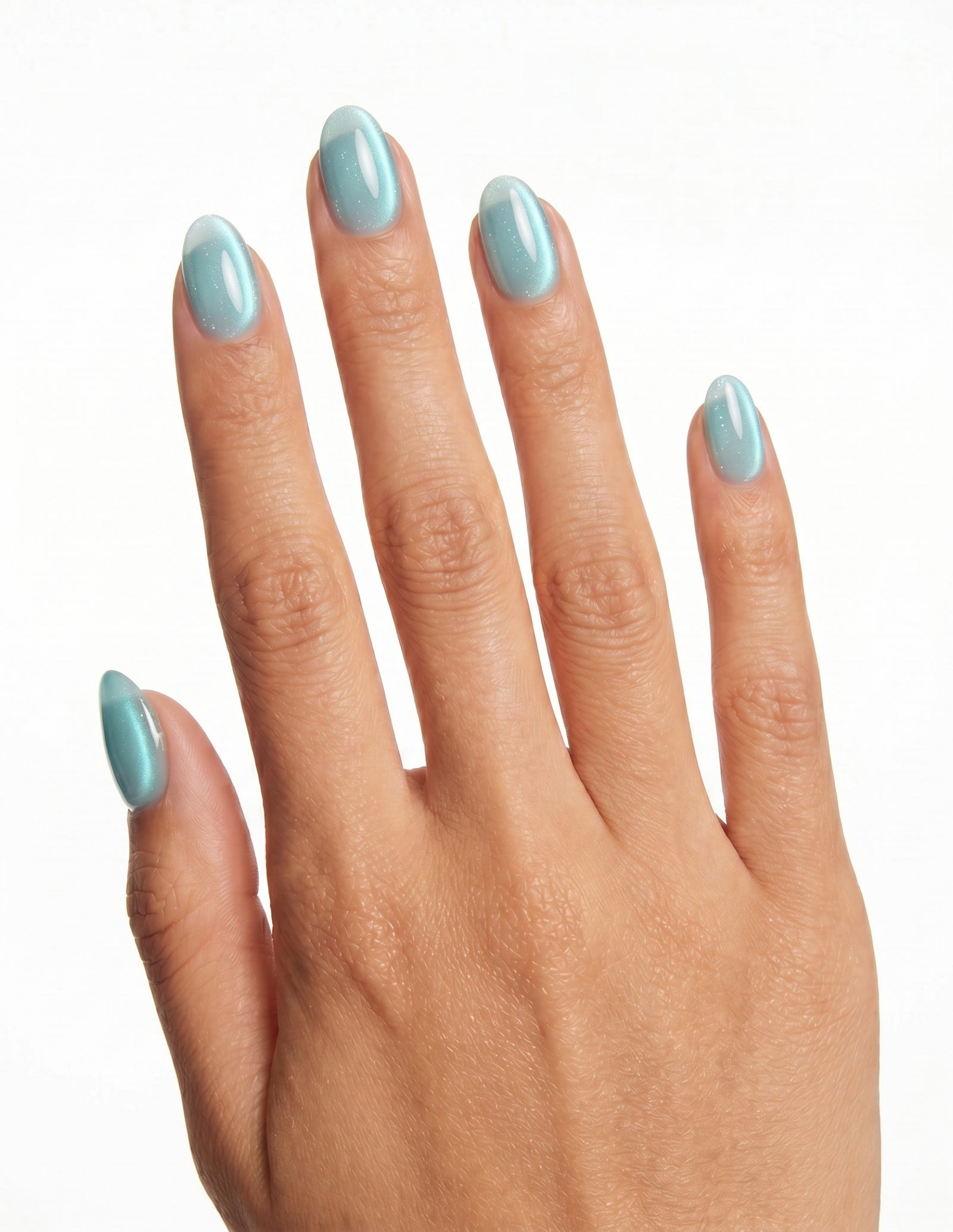 Aurora Lagoon press-on nails — Almond (extra-short), tan hand, back of hand