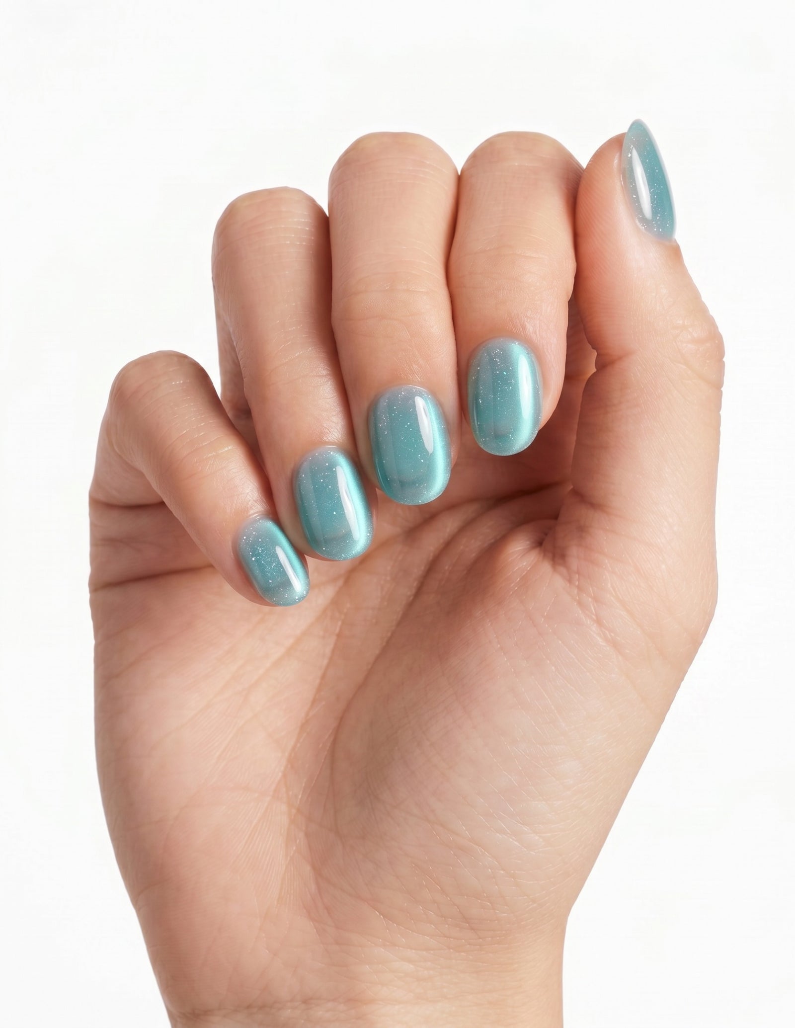 Aurora Lagoon press-on nails — Oval (extra-short), light-skin hand, fingers curled