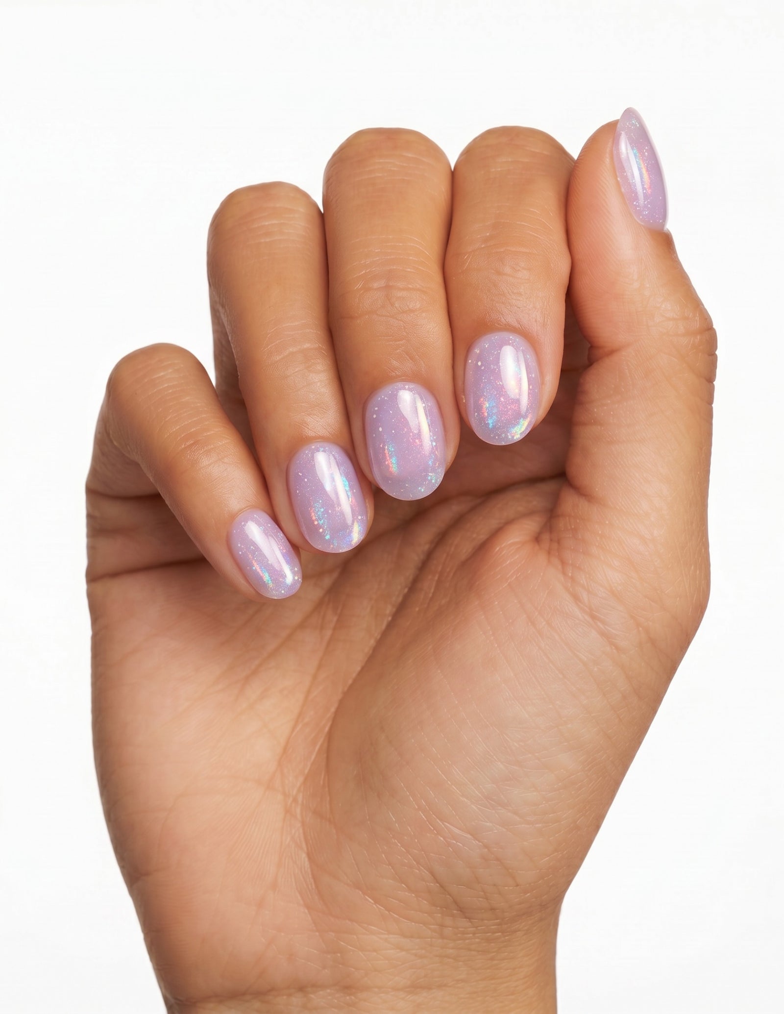 Aurora Lilac press-on nails — Oval (extra-short), tan hand, fingers curled