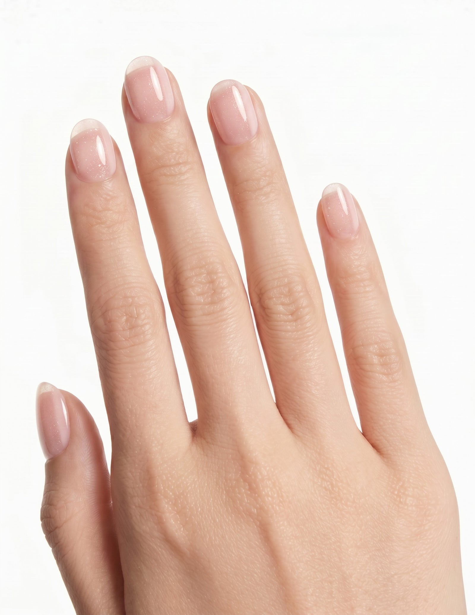 Aurora Champagne press-on nails — Oval (extra-short), light-skin hand, back of hand