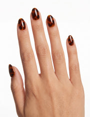 Tortoise press-on nails — Almond (extra-short), light-skin hand, back of hand
